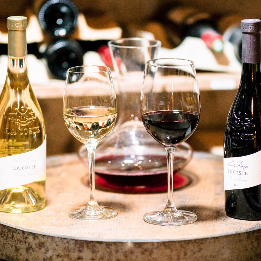 bottles and glasses of wine from the estate of Château La Coste