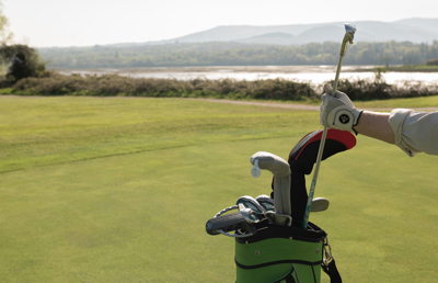 Golfer pulling out clubs at the field