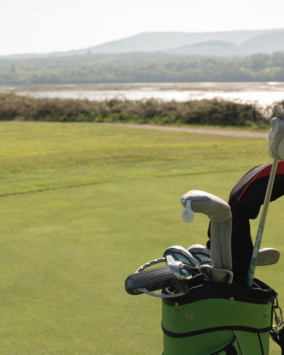 Golfer pulling out clubs at the field